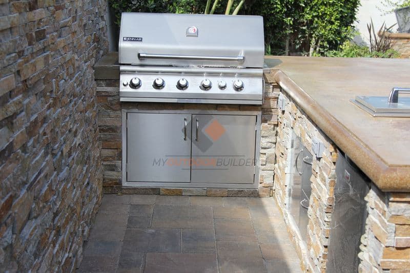 Custom outdoor fire pit and BBQ with paver patio